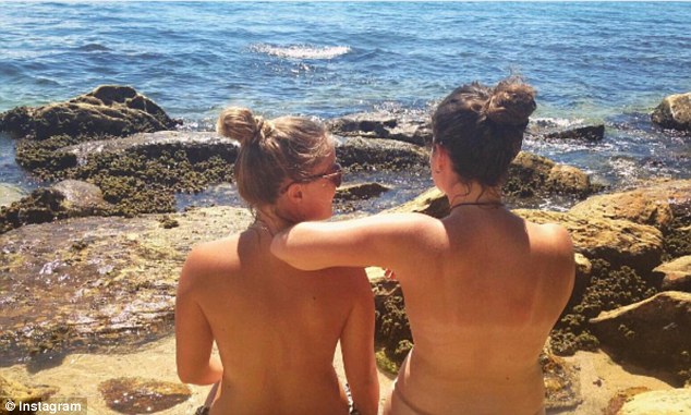 Topless women on beach