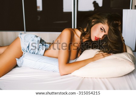 Blonde teen lying on stomach
