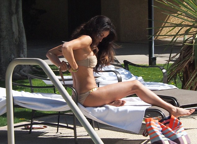 Girl removing bikini top
