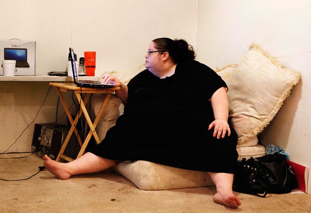 Fat person on computer
