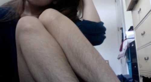 Natural hairy woman legs