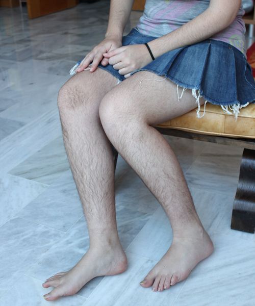 Natural hairy woman legs